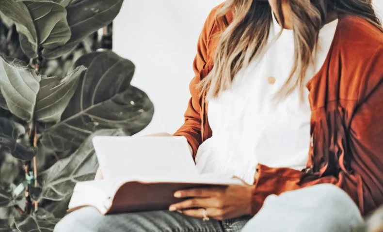 Bibliotherapy’s potential for healing- woman reading a book